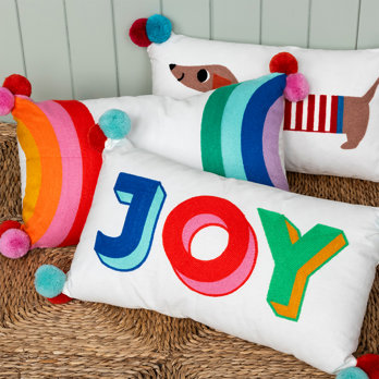embroidered cushion with pom poms - joy