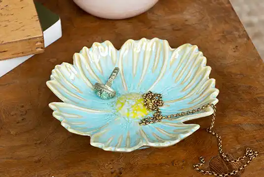 Ceramic trinket dish with an elegant flower shape and design