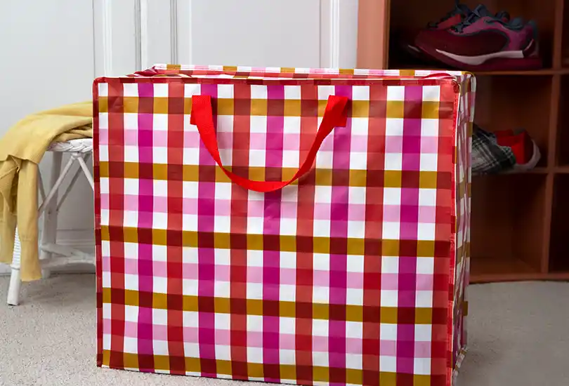 Jumbo storage bags, featuring a multi‑coloured gingham pattern combining shades of pink, yellow, red and white.
