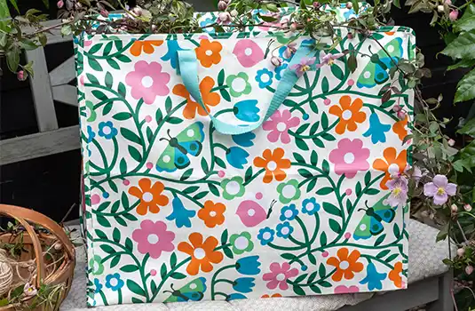Large reusable jumbo storage bag with a colourful floral print.