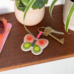 porte-clés simili cuir - papillon