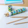 long tube of colouring pencils - prehistoric land