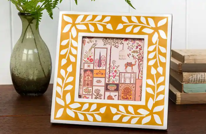 Elegant wooden frame with a decorative white and mustard yellow resin border, featuring a delicate white leaf pattern.