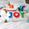 embroidered cushion with pom poms - rainbow