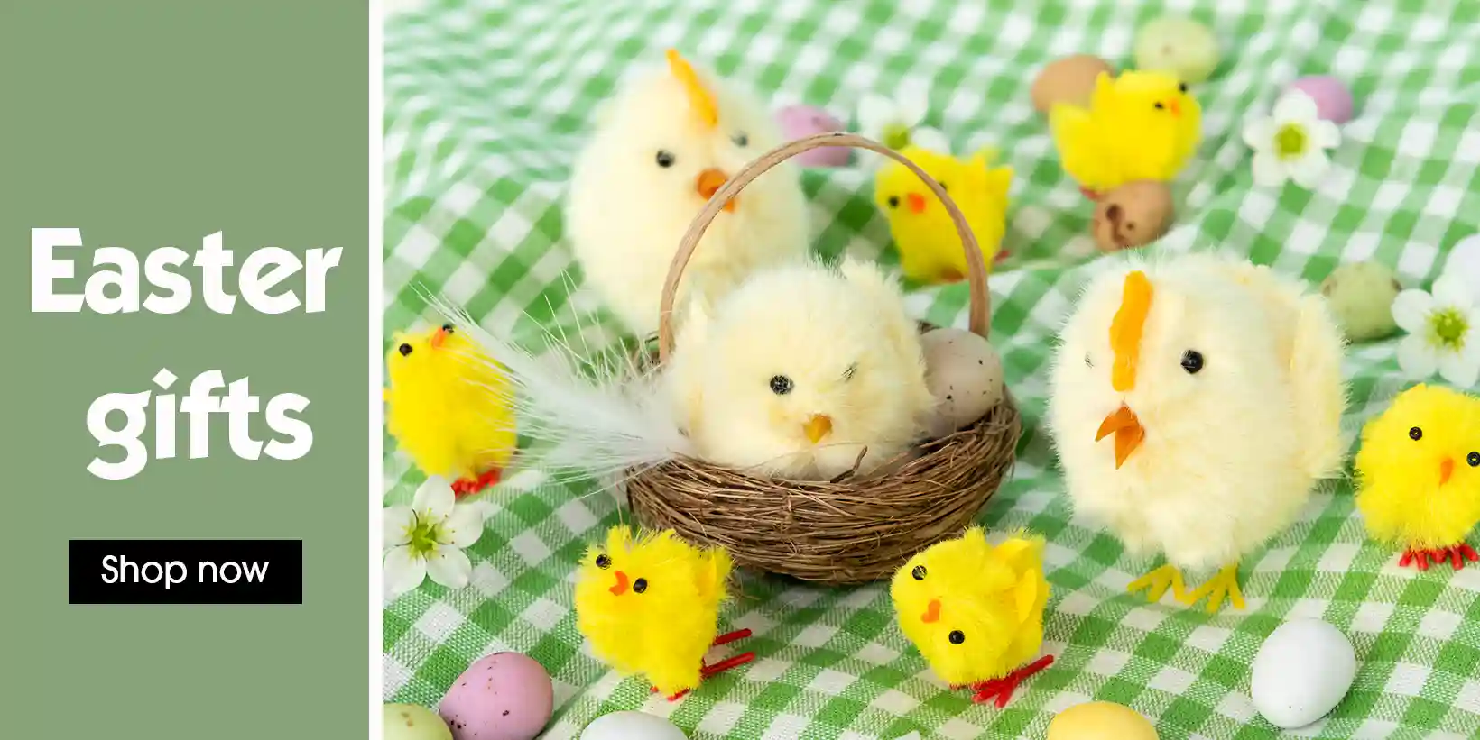 Easter-themed display featuring fluffy yellow toy chicks on a green gingham cloth.