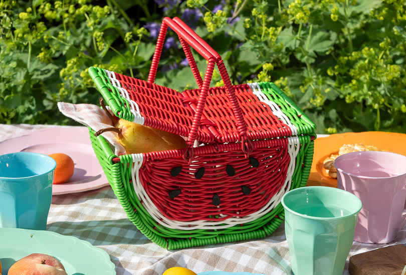 A colorful woven basket shaped like a watermelon