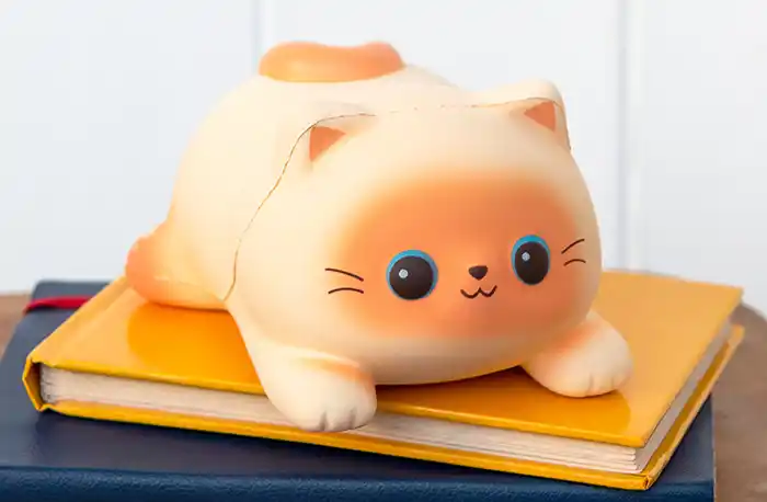 Tactile and soothing toy in the form of cute laying cat. Its soft and durable foam material, makes it great for squishing and squeezing. 