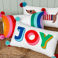 embroidered cushion with pom poms - rainbow